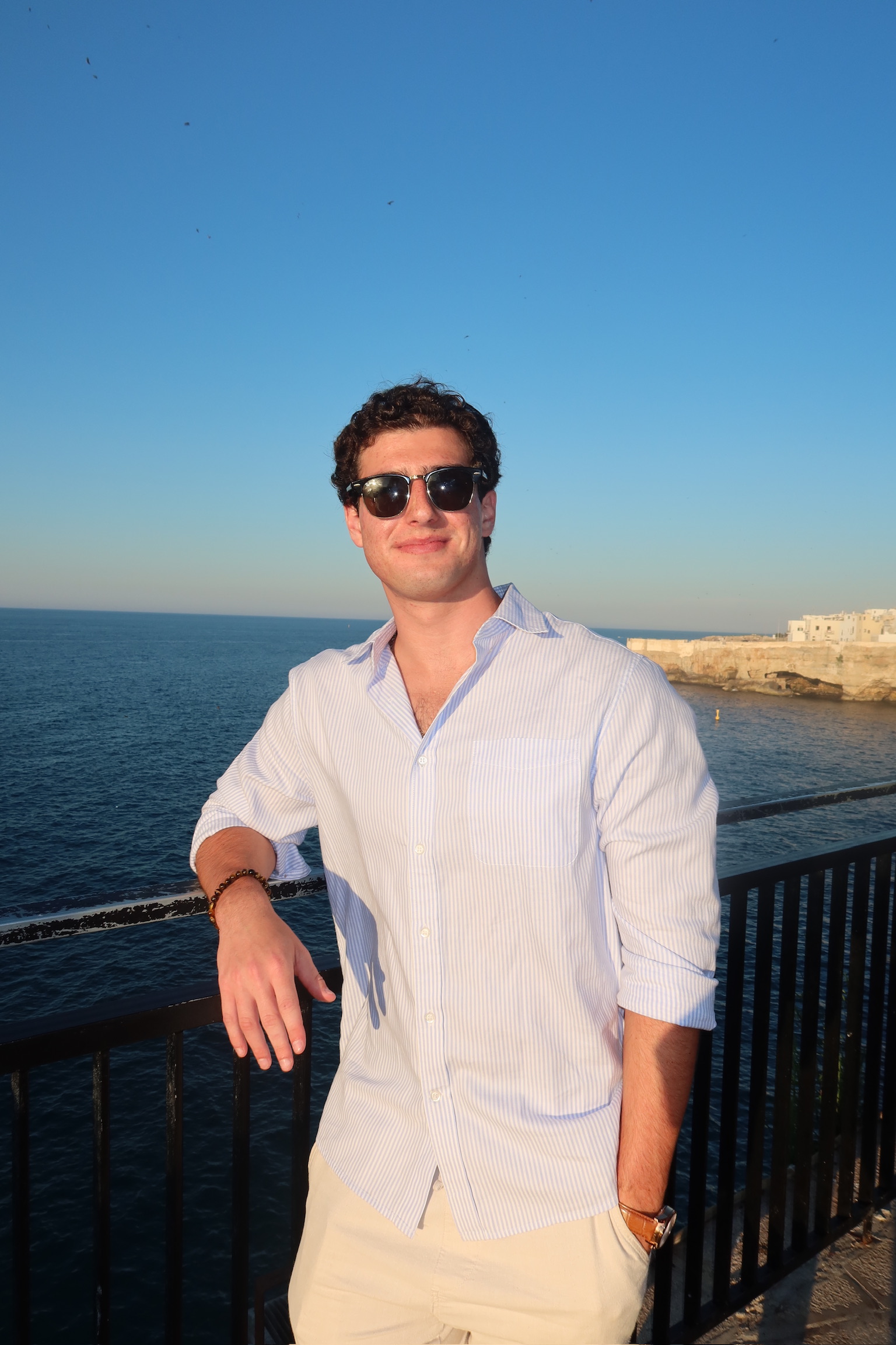 Mark Rome outdoors by the coast